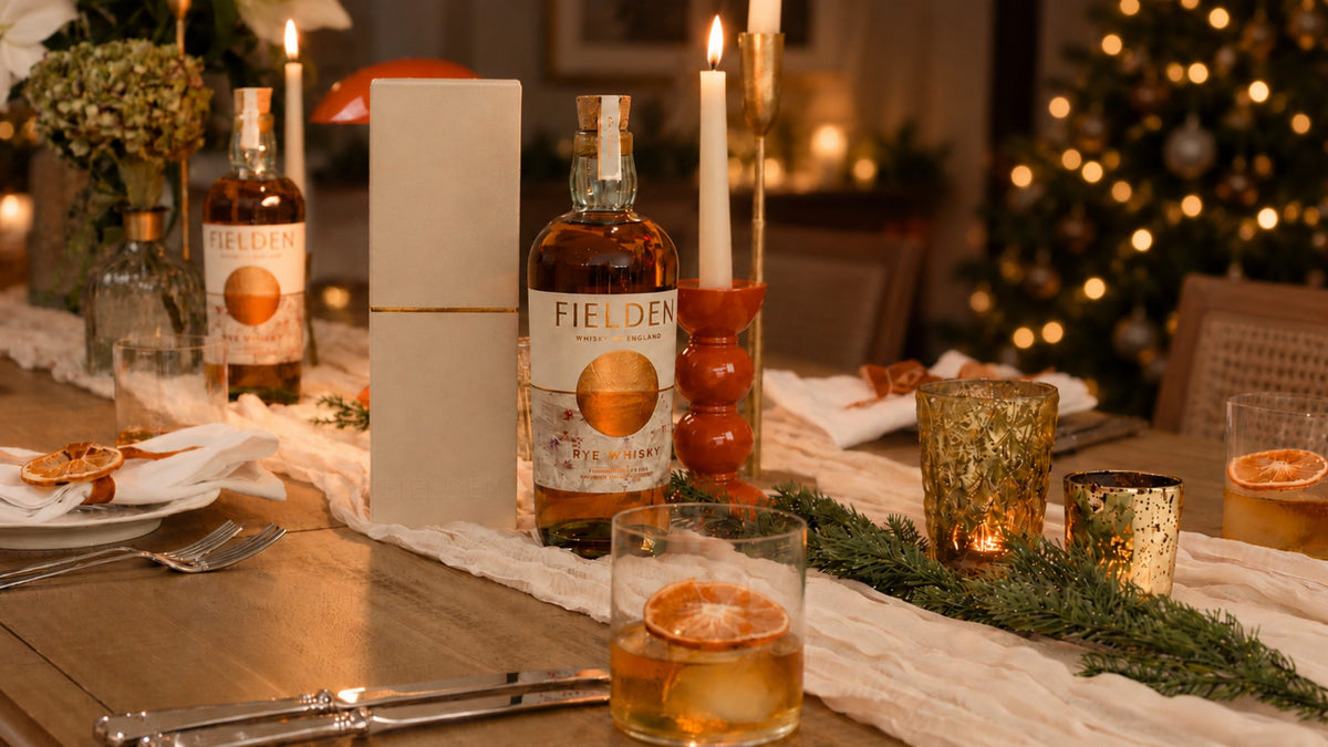 The Fielden whisky range on a candlelit Christmas table